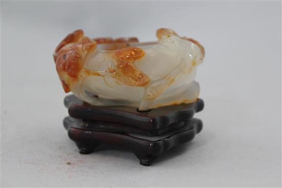 A Chinese chalcedony brush washer, 19th / 20th century, 8.4cm, wood stand